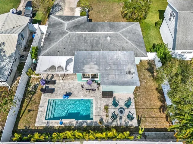 an aerial view of a house with a swimming pool