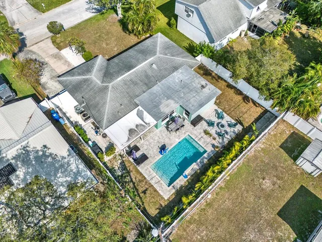 an aerial view of a house with a garden