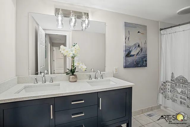 a bathroom with a sink and a mirror