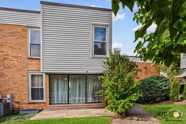 a view of a backyard and a tree