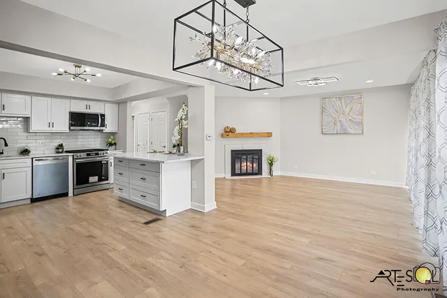 a view of kitchen with sink microwave and stove