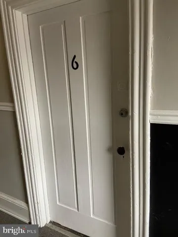 a view of a bathroom from a door