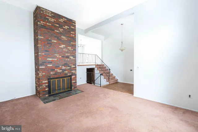 a view of a hallway with staircase