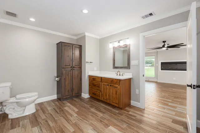 a house view with swimming pool in front of it