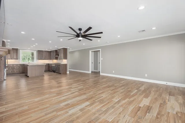 a stove top oven sitting inside of a kitchen