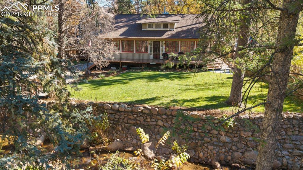 1515 West Cheyenne Road Colorado Springs, CO 80906 - Photo 13 of 50 a house with swimming pool in front of it