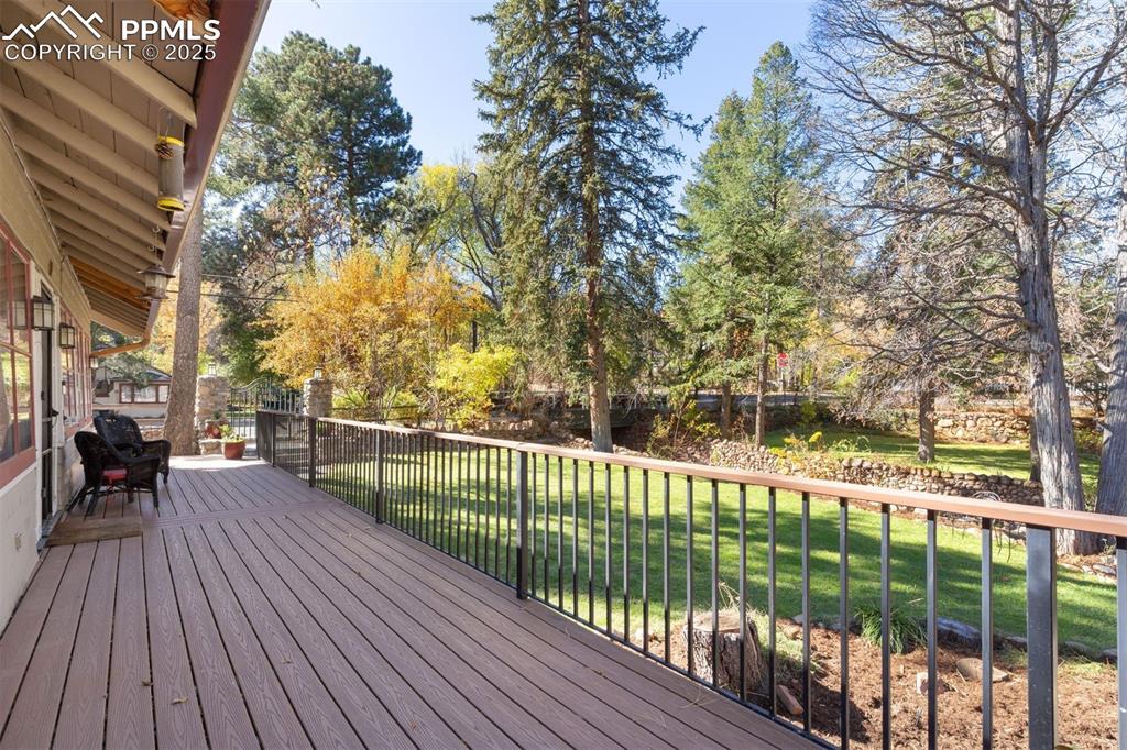 1515 West Cheyenne Road Colorado Springs, CO 80906 - Photo 15 of 50 a view of a balcony with wooden floor and bench