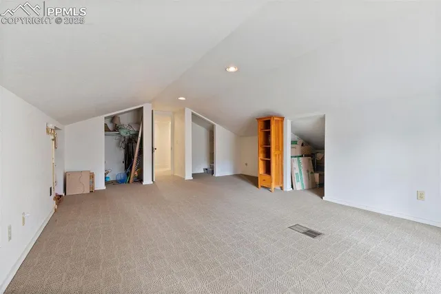 a view of empty room with closet