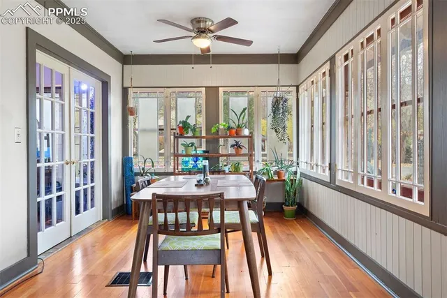 a view of a dining room with furniture window and wooden floor