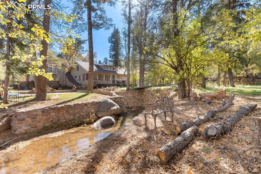 1515 West Cheyenne Road Colorado Springs, CO 80906 - Photo 45 of 50 a view of a yard with large trees