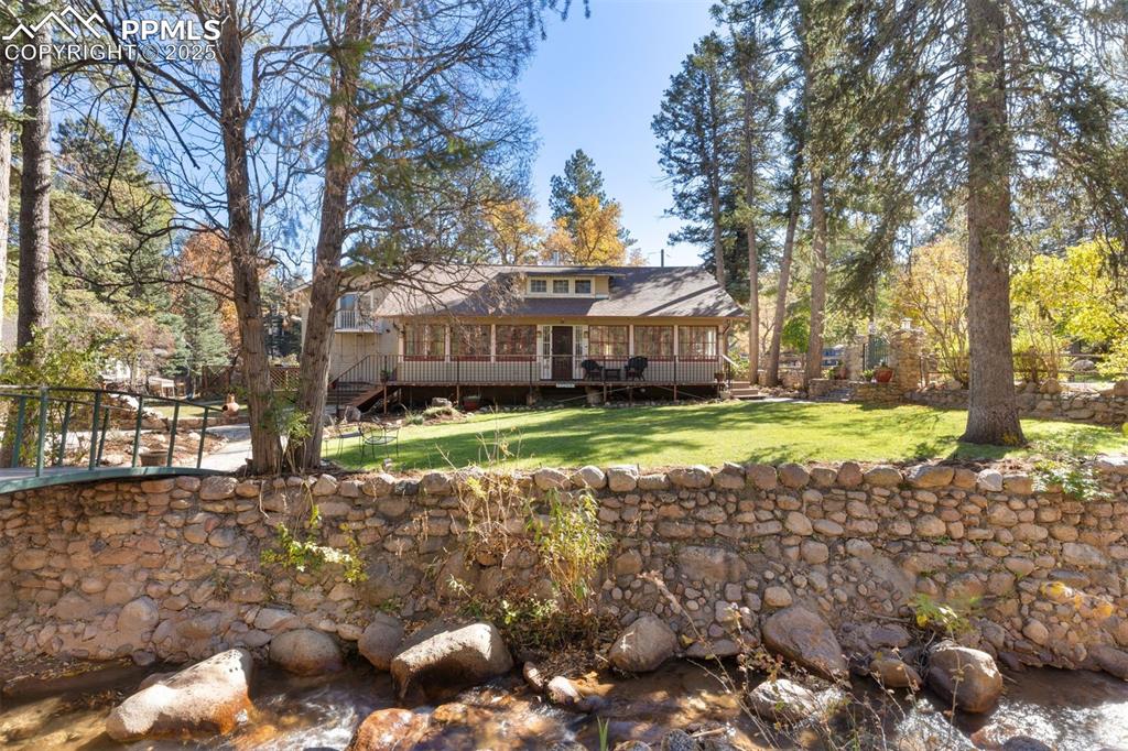 1515 West Cheyenne Road Colorado Springs, CO 80906 - Photo 48 of 50 a view of a house with a yard