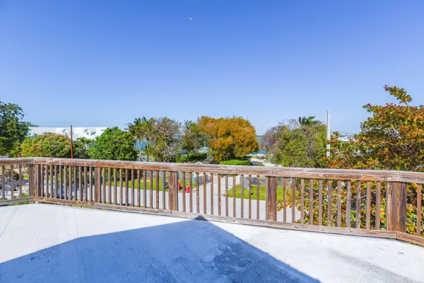 a view of a roof with wooden fence