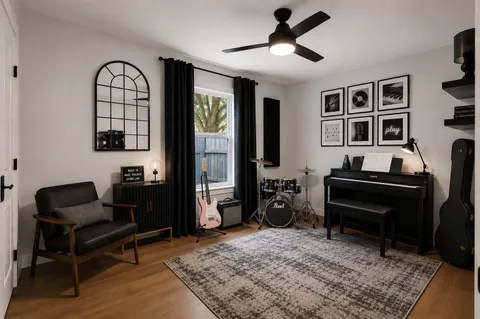 a living room with furniture piano and a window