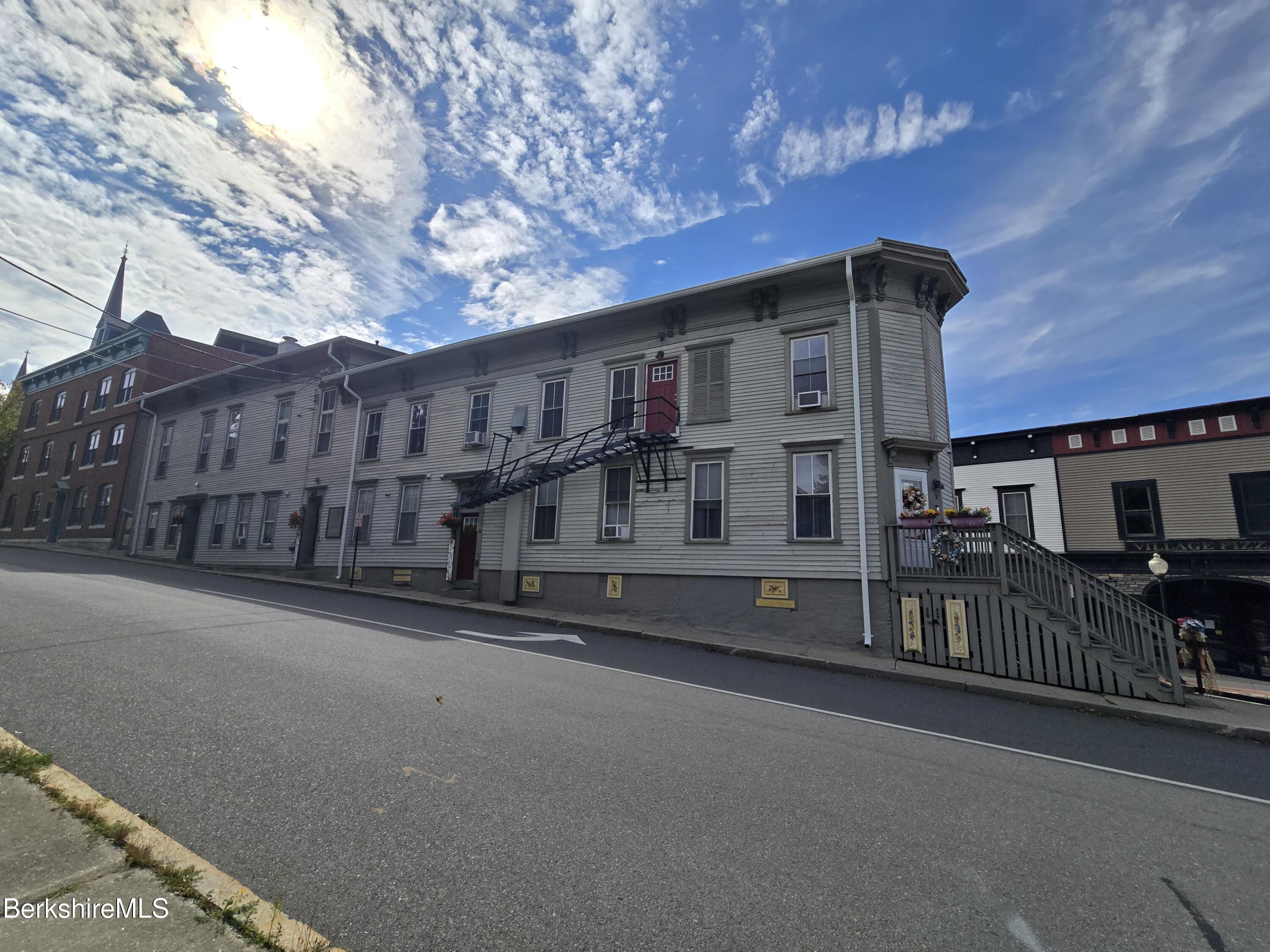 19 Church Street, Unit 12 North Adams, MA 01247 - Photo 3 of 16 a view of a house with wooden fence