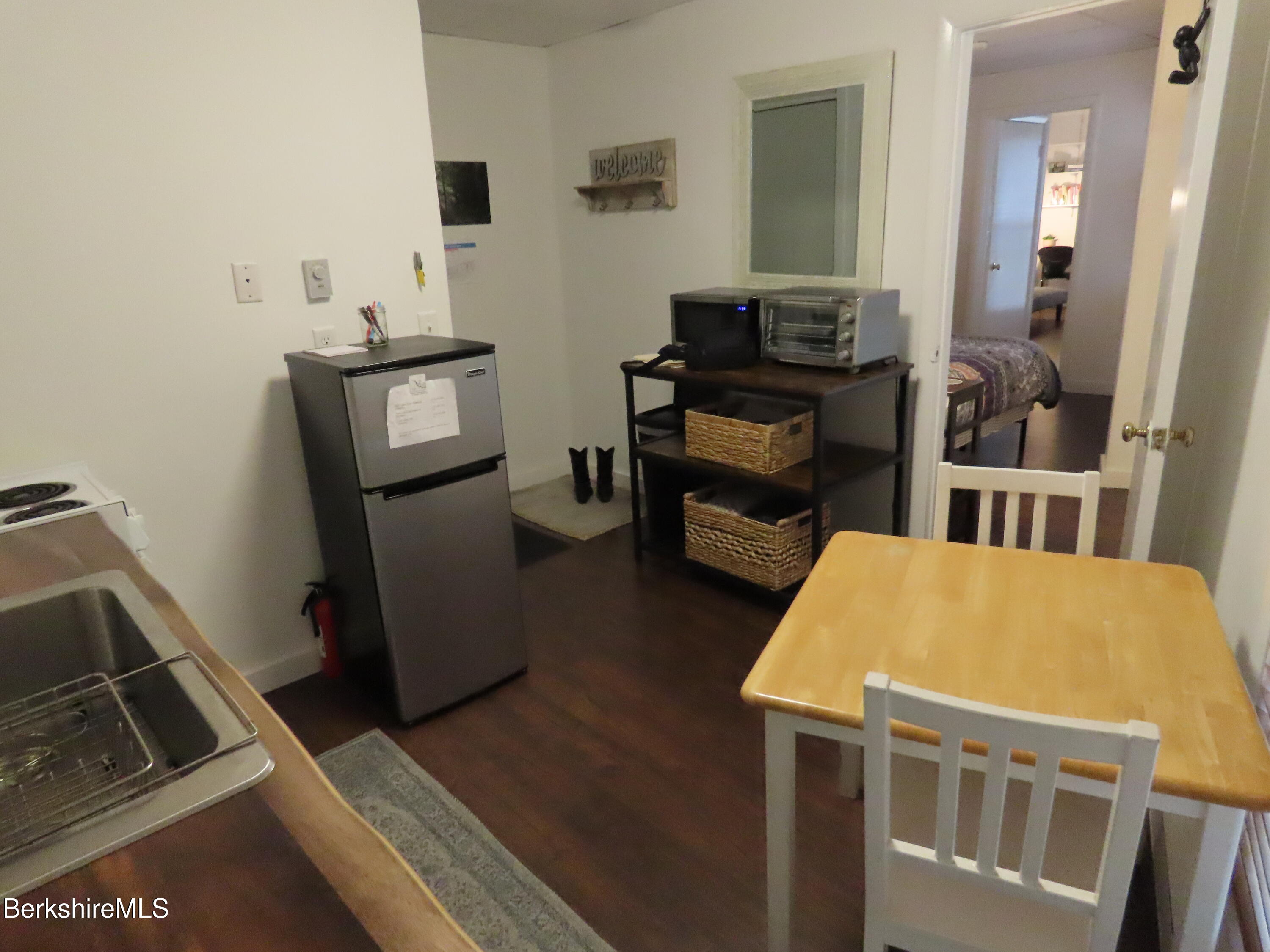 19 Church Street, Unit 12 North Adams, MA 01247 - Photo 7 of 16 a living room with furniture and a flat screen tv