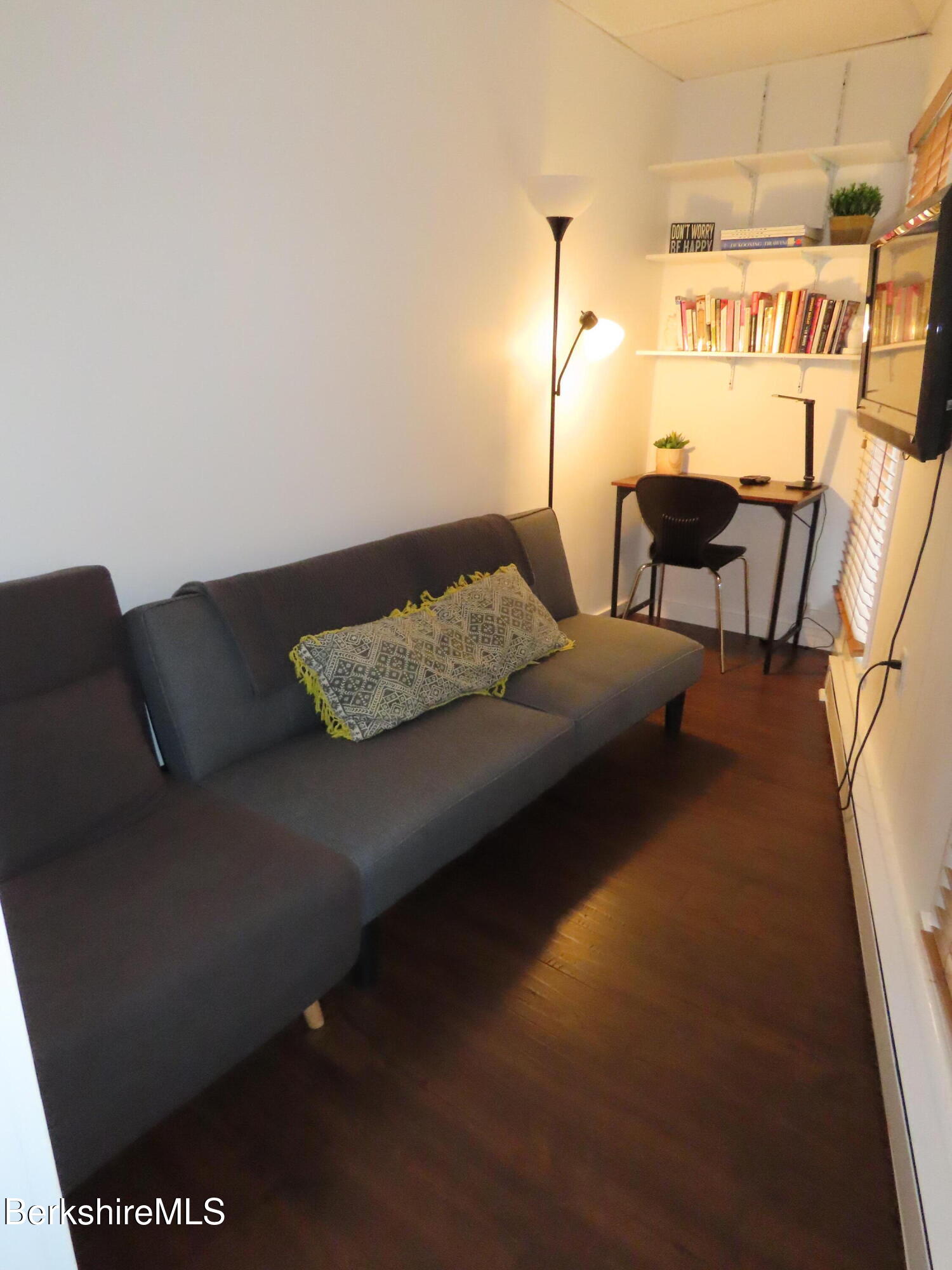19 Church Street, Unit 12 North Adams, MA 01247 - Photo 9 of 16 a living room with furniture and a rug