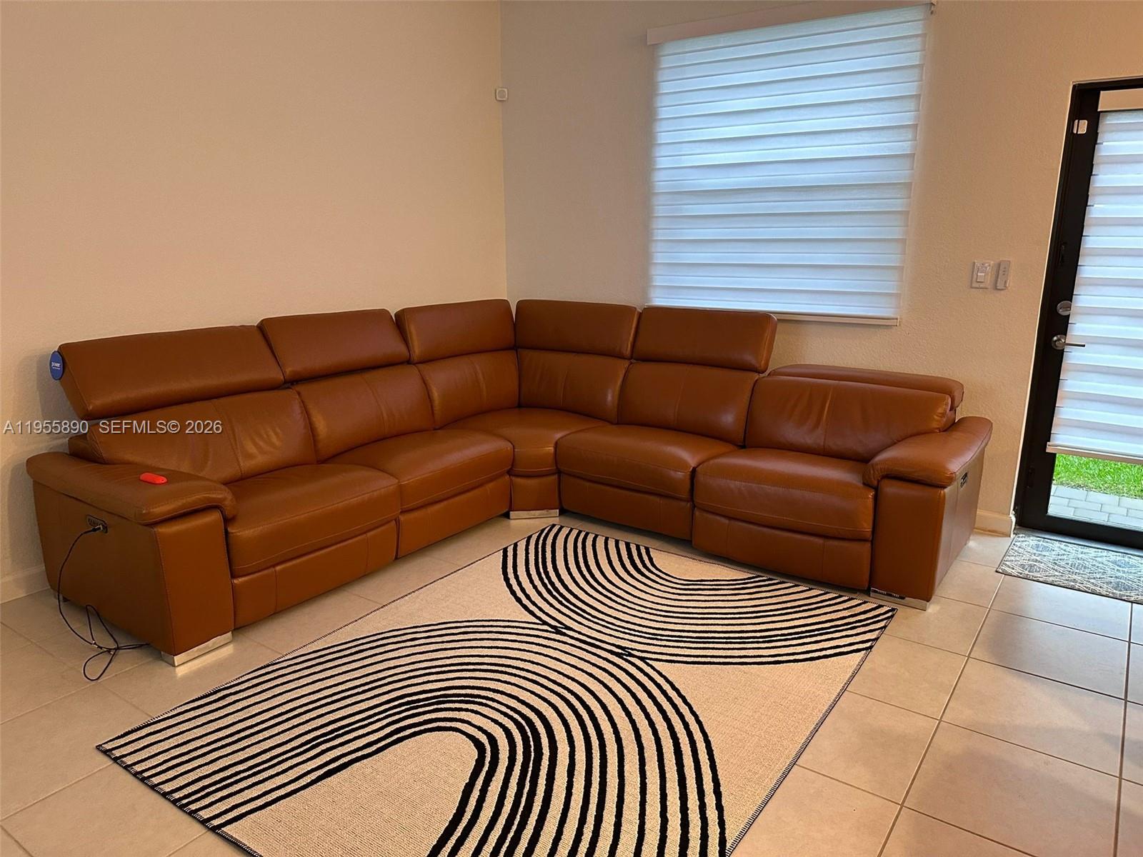 12961 Southwest 230th Street Miami, FL 33170 - Photo 13 of 39 a view of a living room a couch and a window