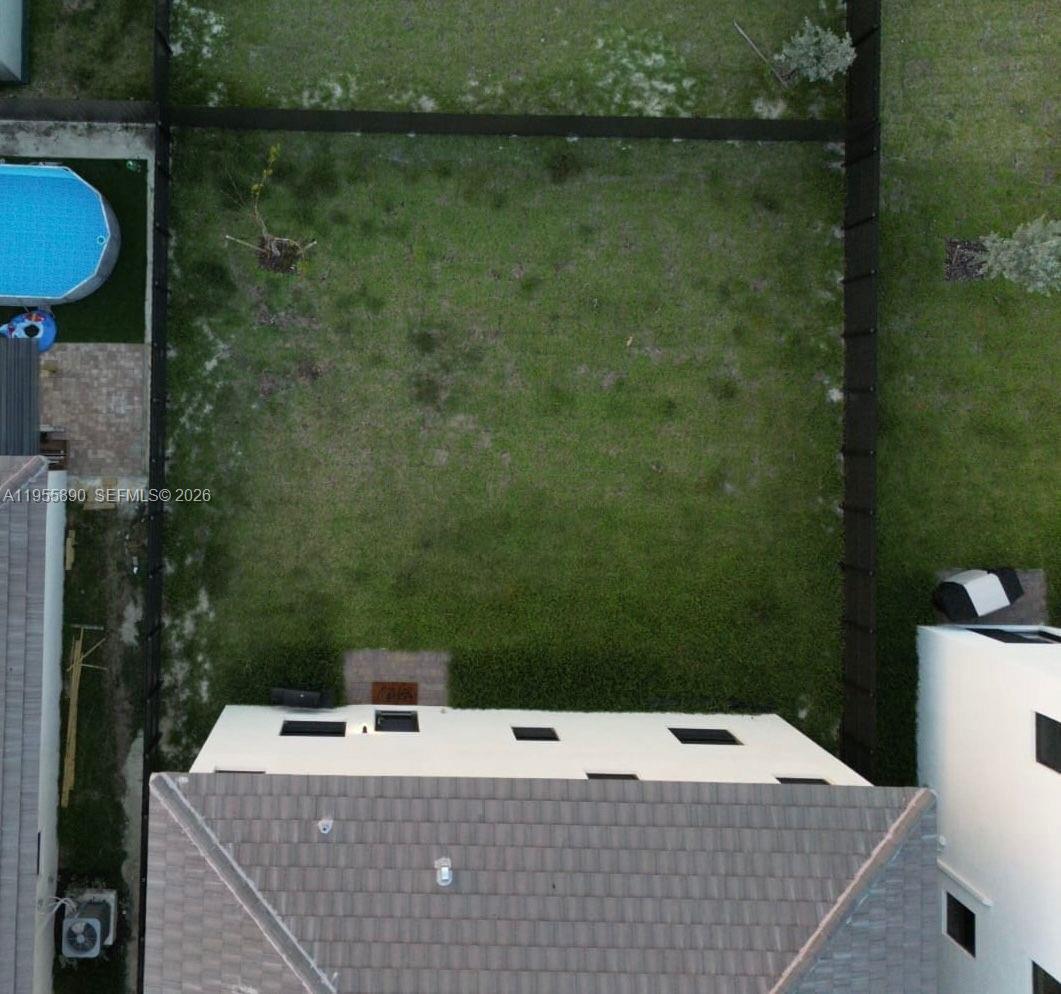 12961 Southwest 230th Street Miami, FL 33170 - Photo 14 of 39 a view of a house with a yard