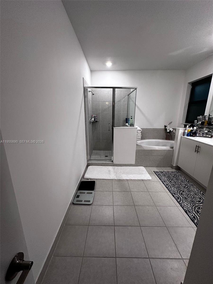 12961 Southwest 230th Street Miami, FL 33170 - Photo 17 of 39 a view of a refrigerator in kitchen and utility room