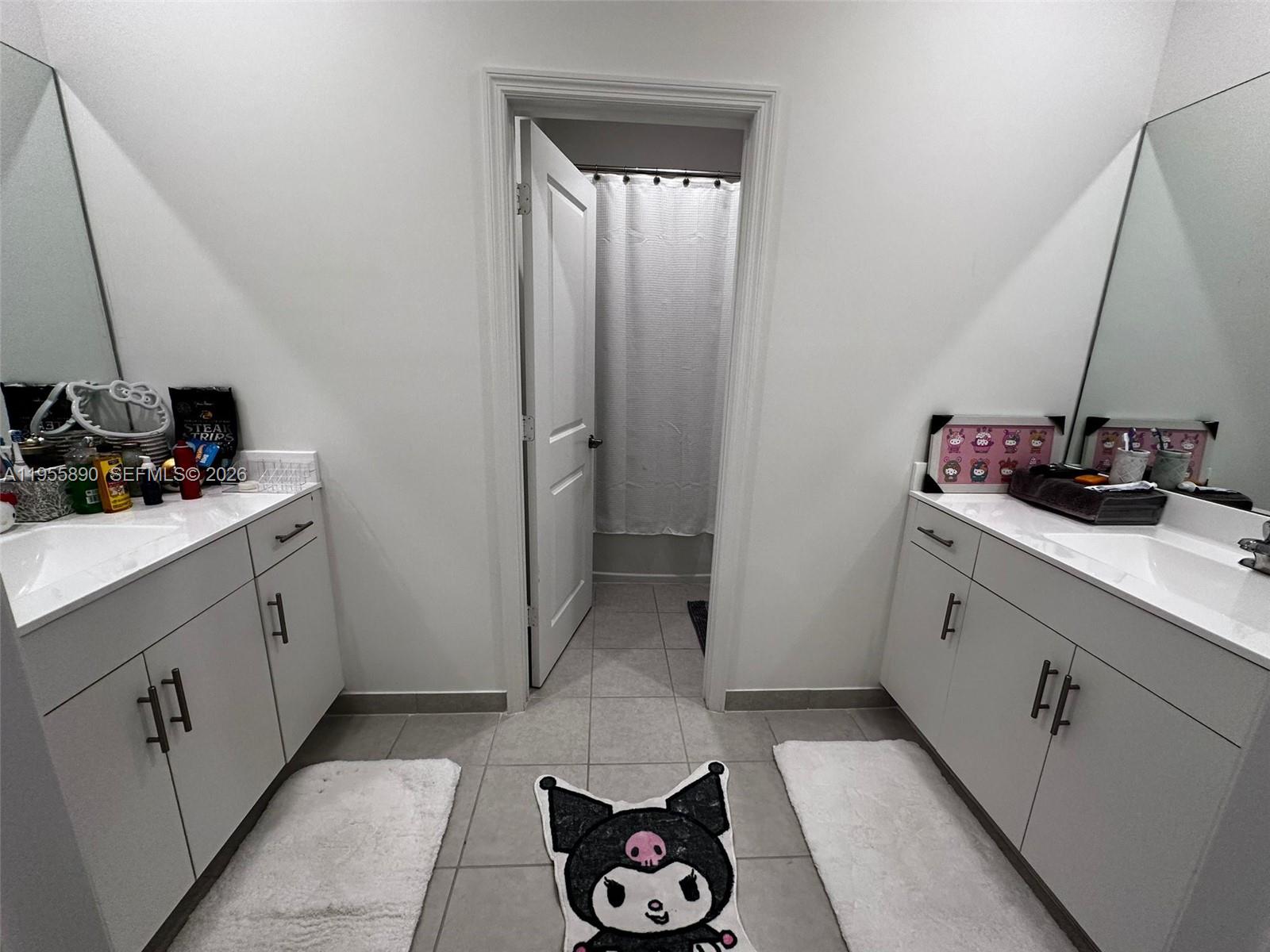 12961 Southwest 230th Street Miami, FL 33170 - Photo 23 of 39 a bathroom with a sink and a mirror