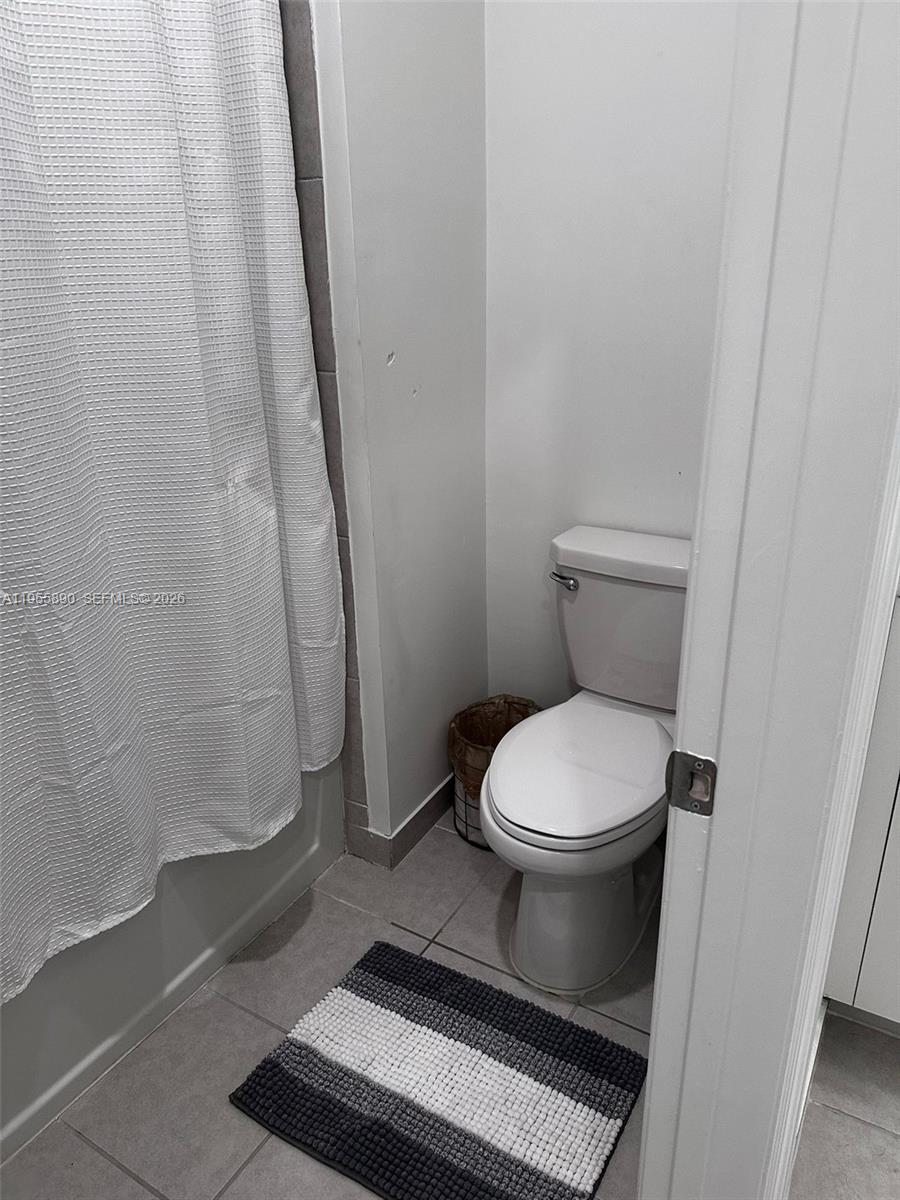 12961 Southwest 230th Street Miami, FL 33170 - Photo 26 of 39 a bathroom with a toilet and a shower