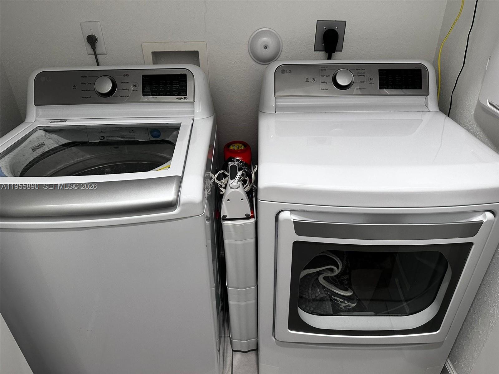 12961 Southwest 230th Street Miami, FL 33170 - Photo 28 of 39 a close up view of washer and dryer