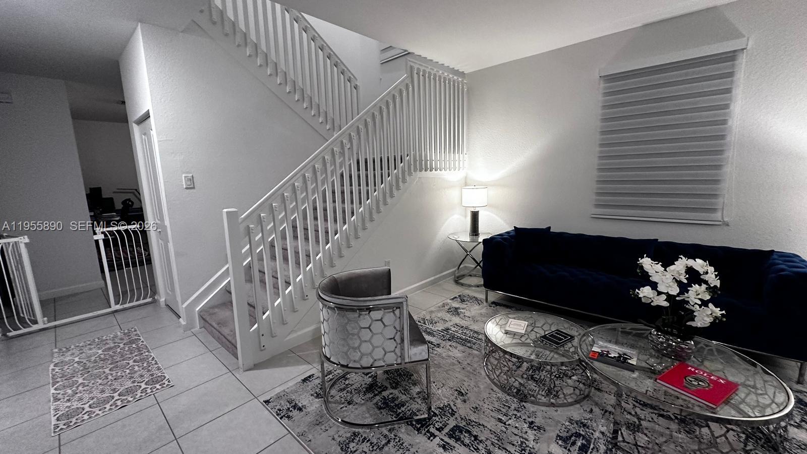 12961 Southwest 230th Street Miami, FL 33170 - Photo 31 of 39 a living room with chairs