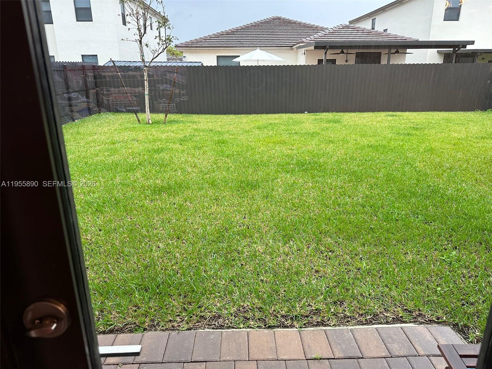 12961 Southwest 230th Street Miami, FL 33170 - Photo 8 of 39 a view of backyard with green space