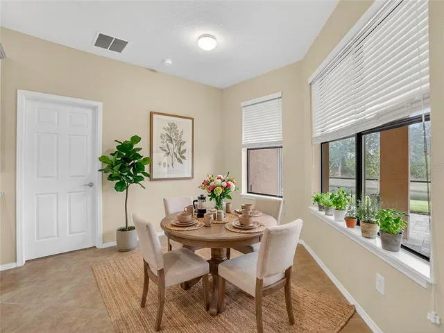 a bedroom with a bed and a lamp