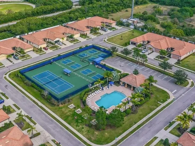 a sign that is sitting in front of flowers