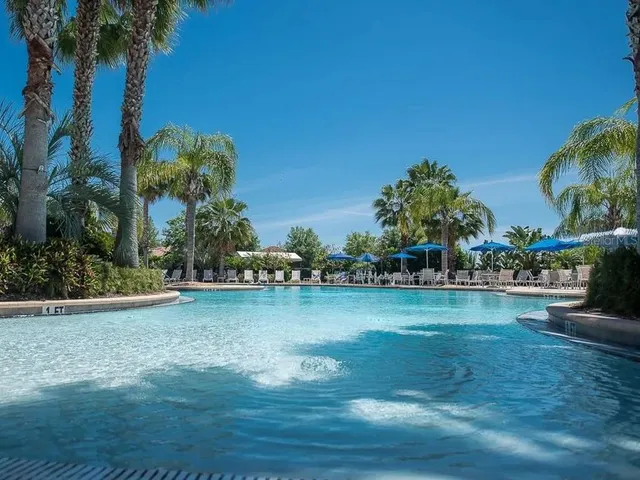 a view of a chair and table on the deck