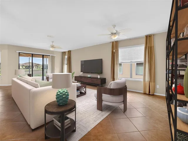 a living room with furniture and a large window