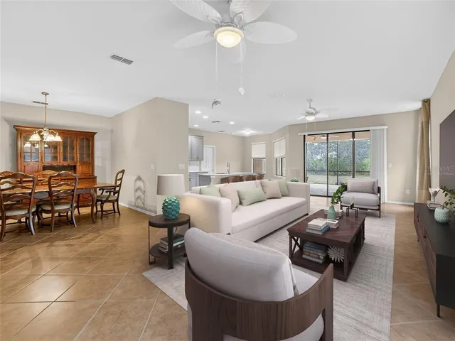 a view of kitchen with stainless steel appliances granite countertop a stove a sink a refrigerator a microwave and cabinets