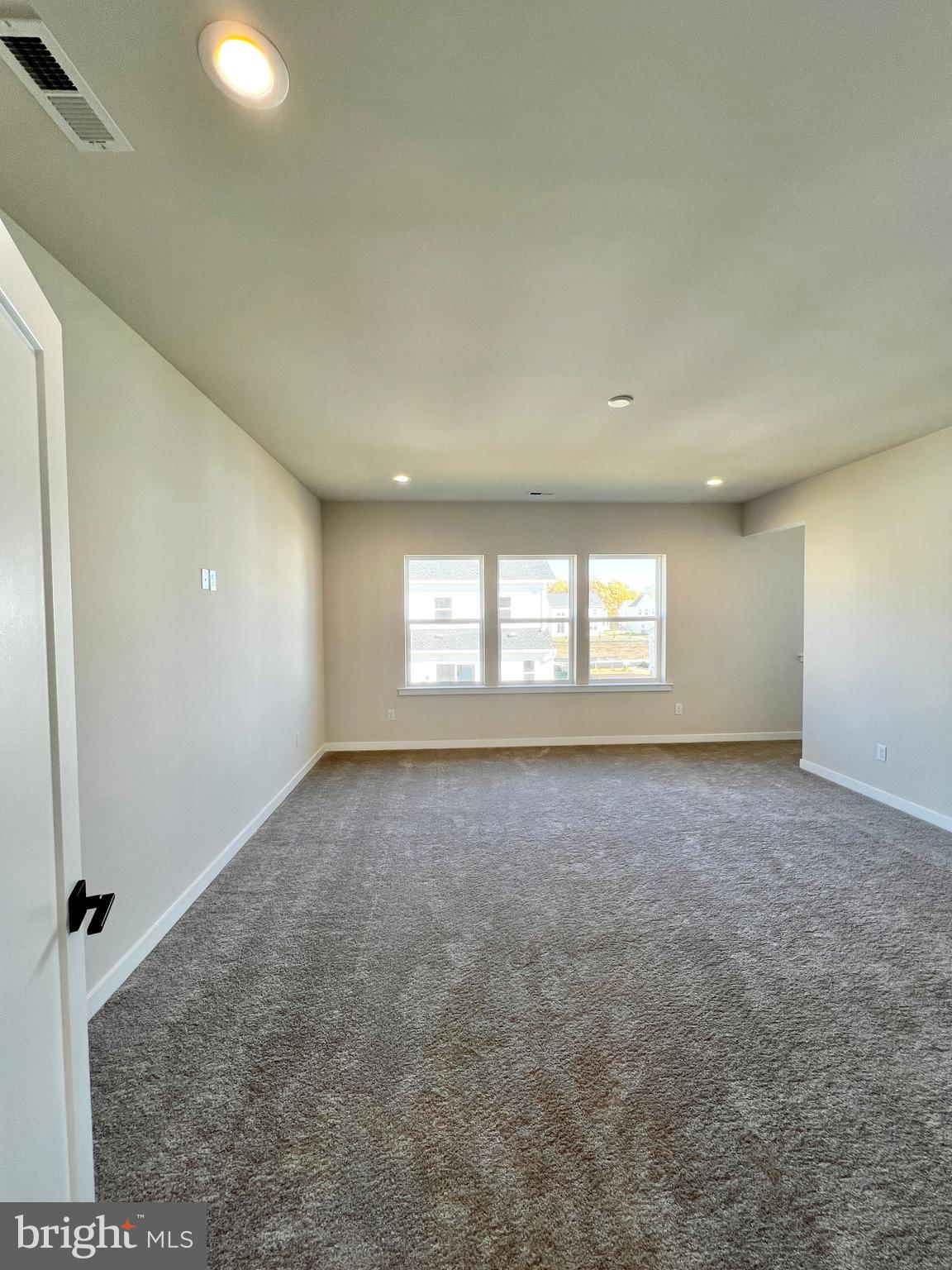 1018 East Lock Road Middletown, DE 19709 - Photo 29 of 51 an empty room with a window and a fireplace