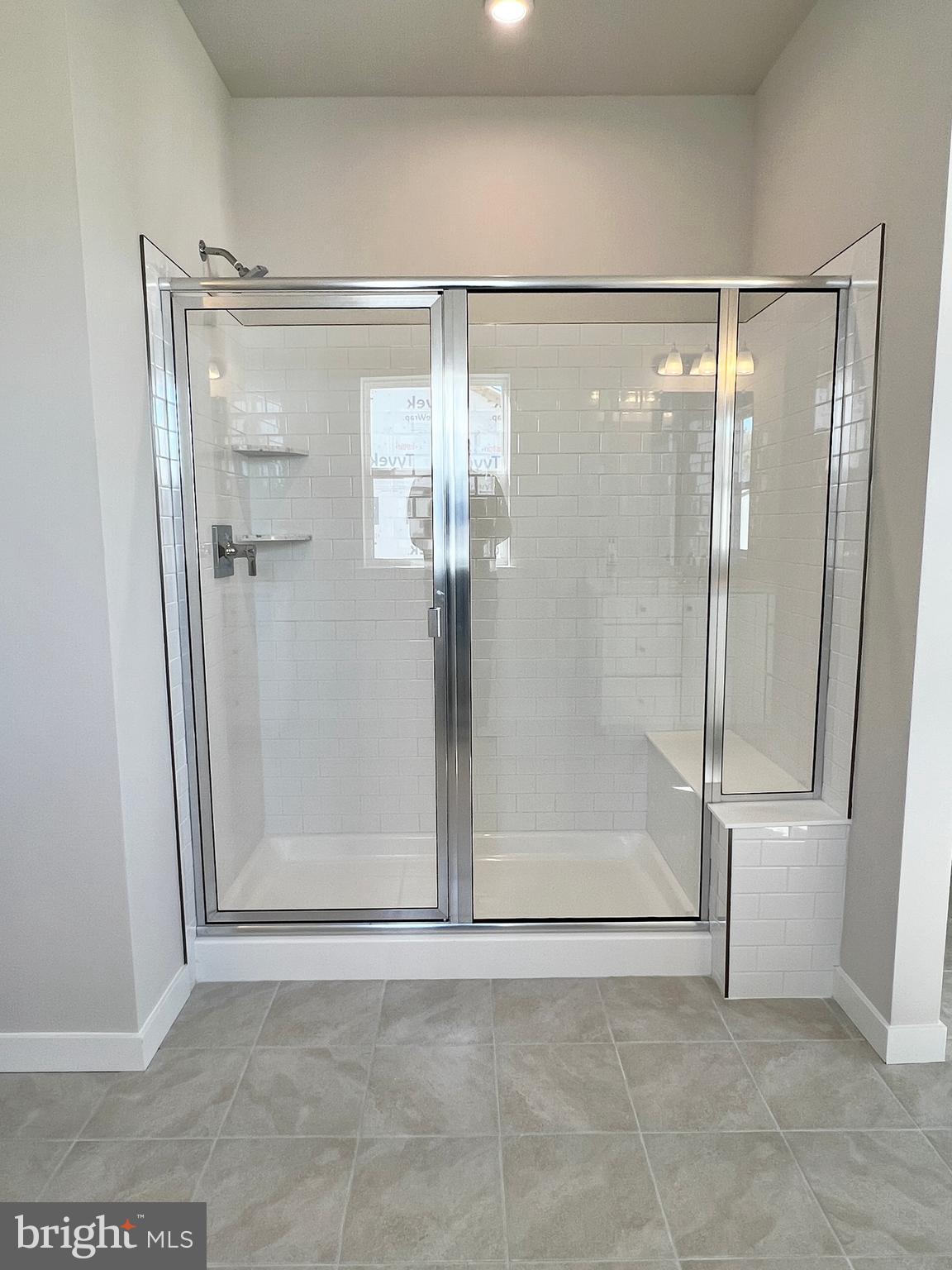 1018 East Lock Road Middletown, DE 19709 - Photo 35 of 51 a bathroom with a glass shower door