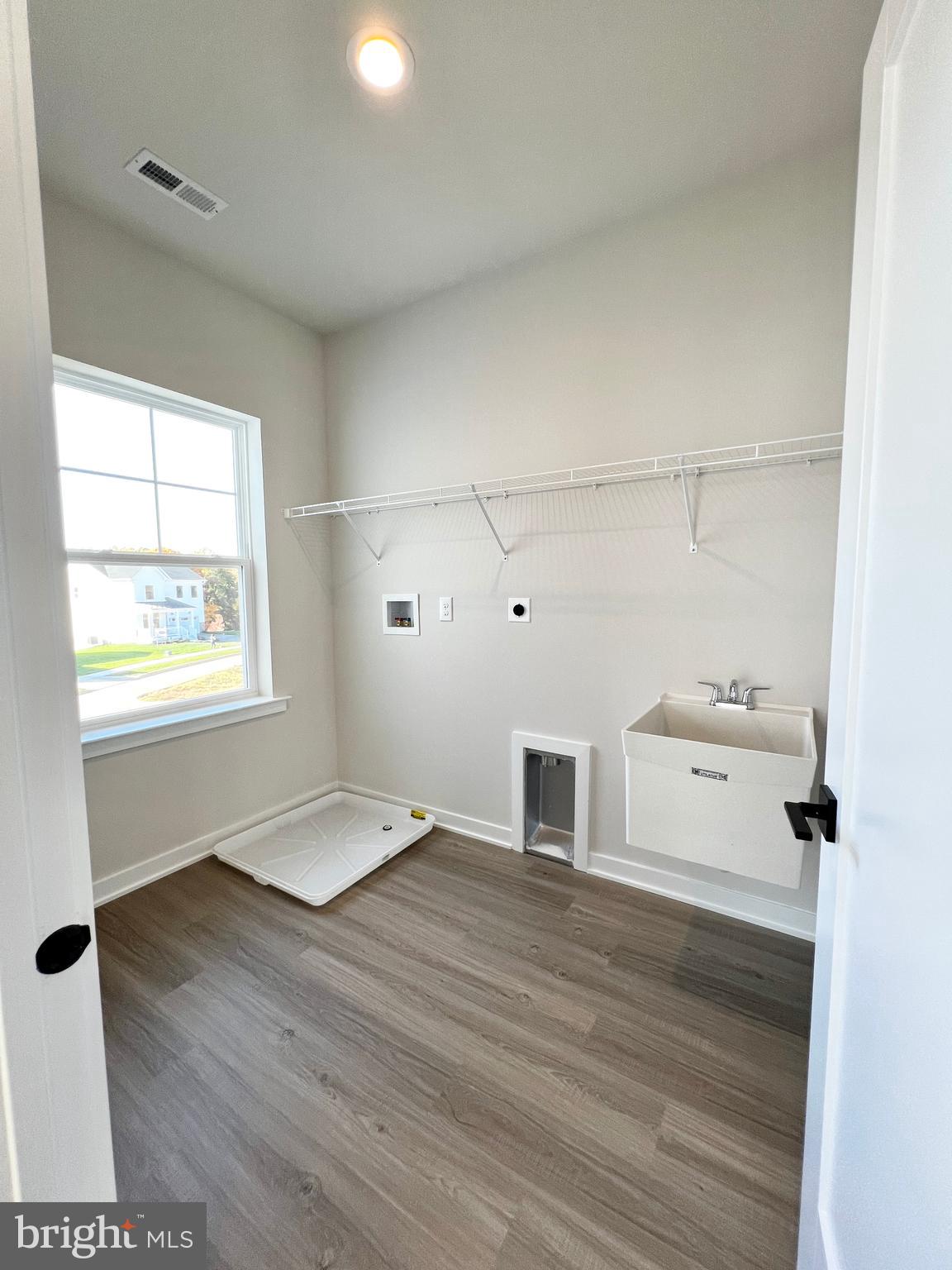 1018 East Lock Road Middletown, DE 19709 - Photo 38 of 51 a view of a kitchen with wooden floor and electronic appliances