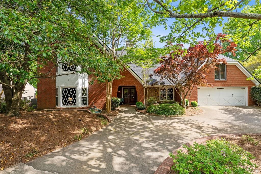 a house with a tree in front of it