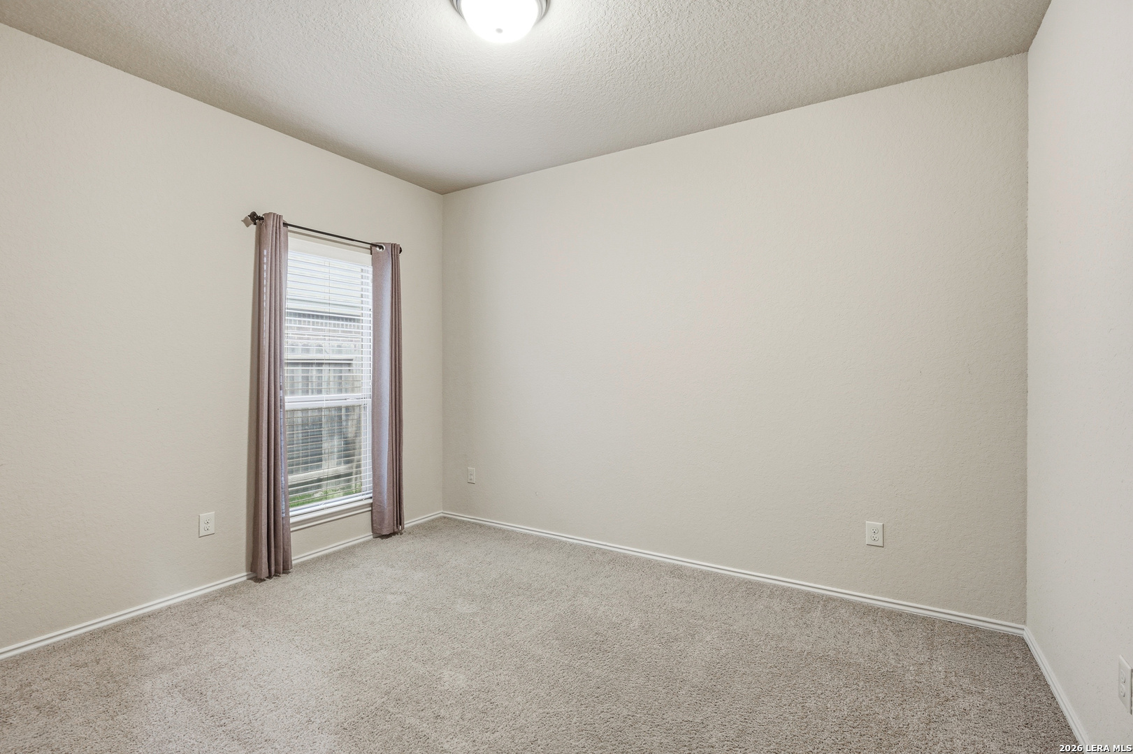 2129 Range Road Seguin, TX 78155 - Photo 27 of 41 an empty room with a empty space and a window