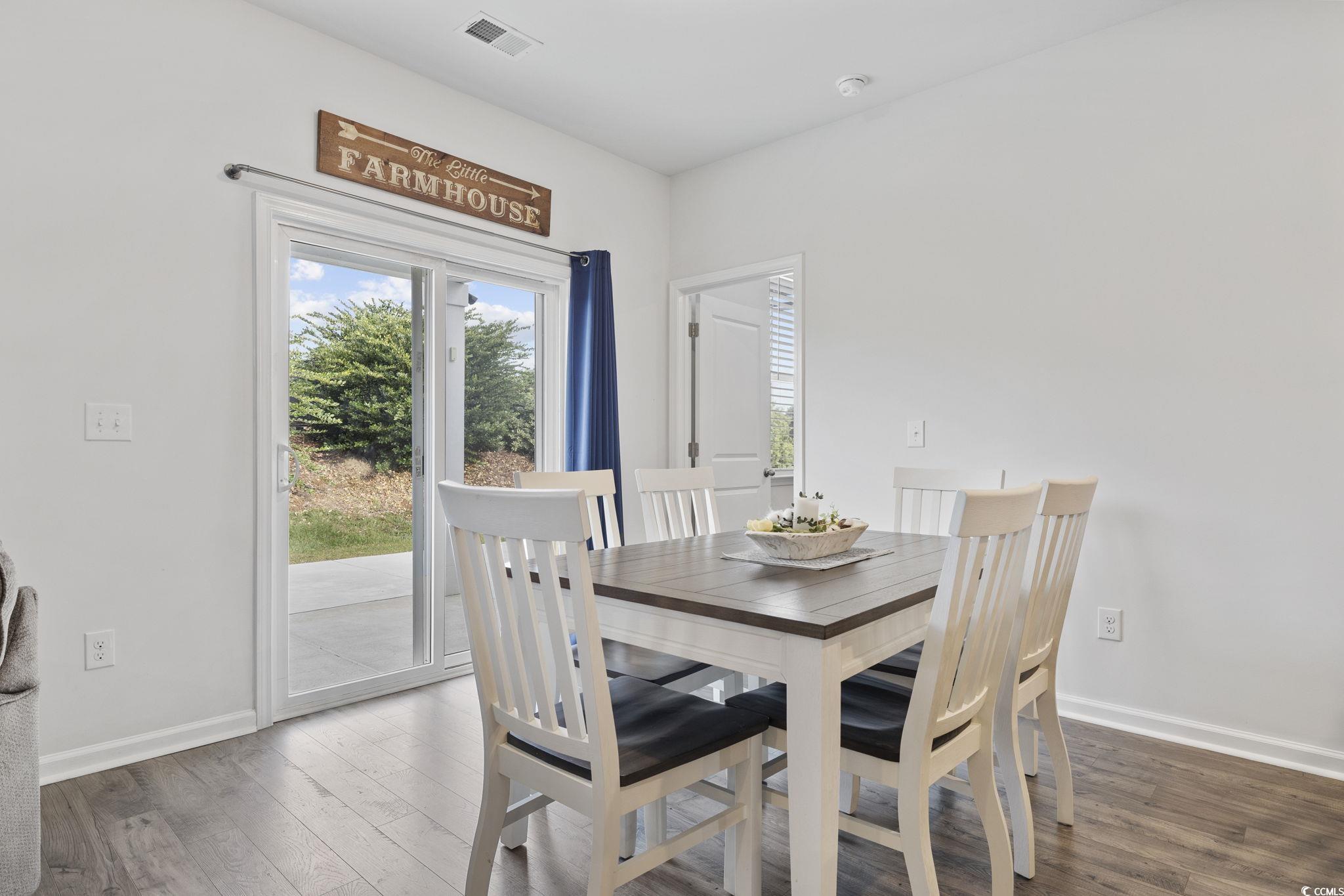 2816 Ophelia Way Myrtle Beach, SC 29577 - Photo 18 of 39 Dining space featuring hardwood / wood-style flooring and baseboards