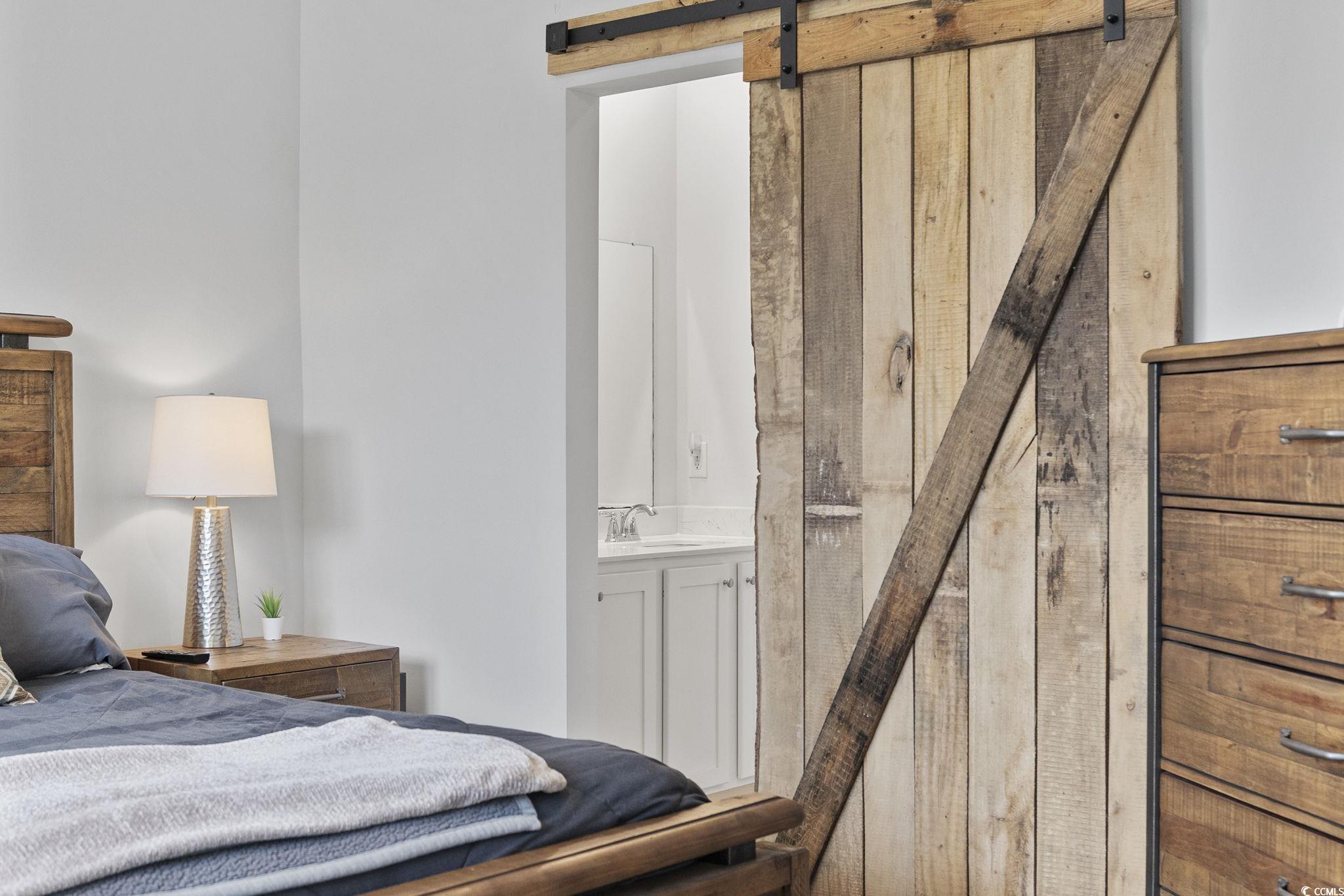 2816 Ophelia Way Myrtle Beach, SC 29577 - Photo 21 of 39 Bedroom featuring a barn door