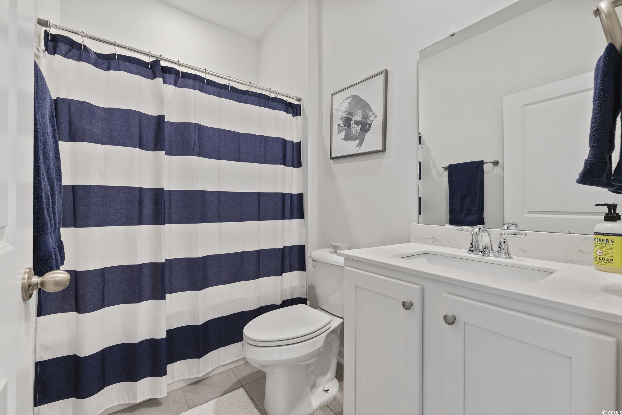 2816 Ophelia Way Myrtle Beach, SC 29577 - Photo 9 of 39 Full bathroom with a shower with curtain, vanity, and light tile patterned flooring