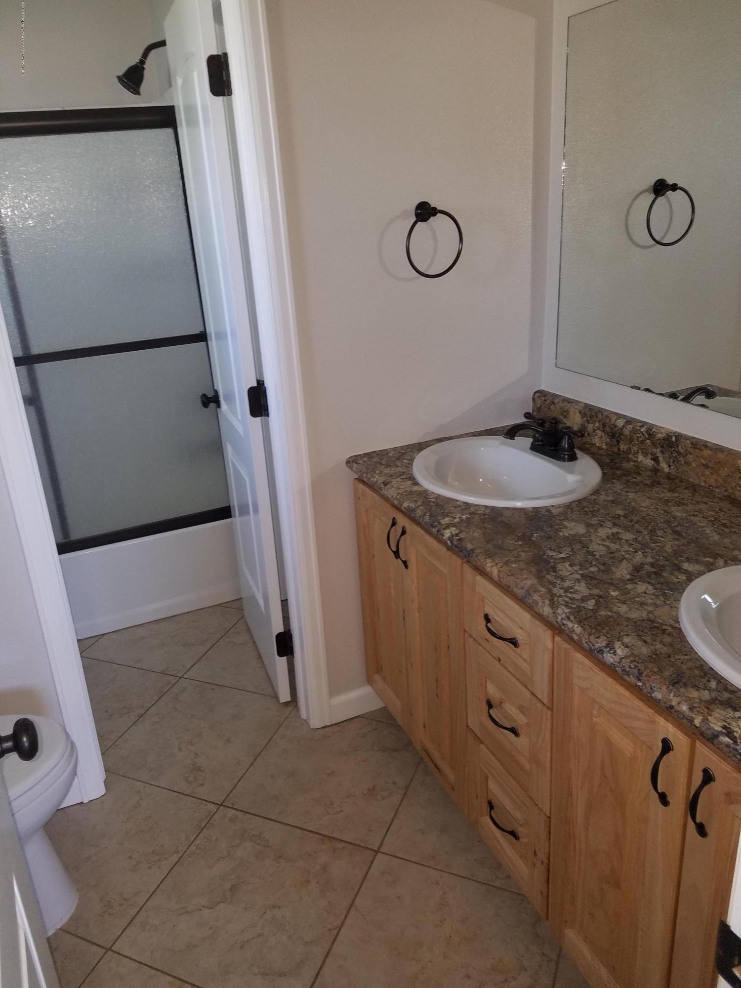 730 Green Street Craig, CO 81625 - Photo 12 of 34 a bathroom with a sink and mirror