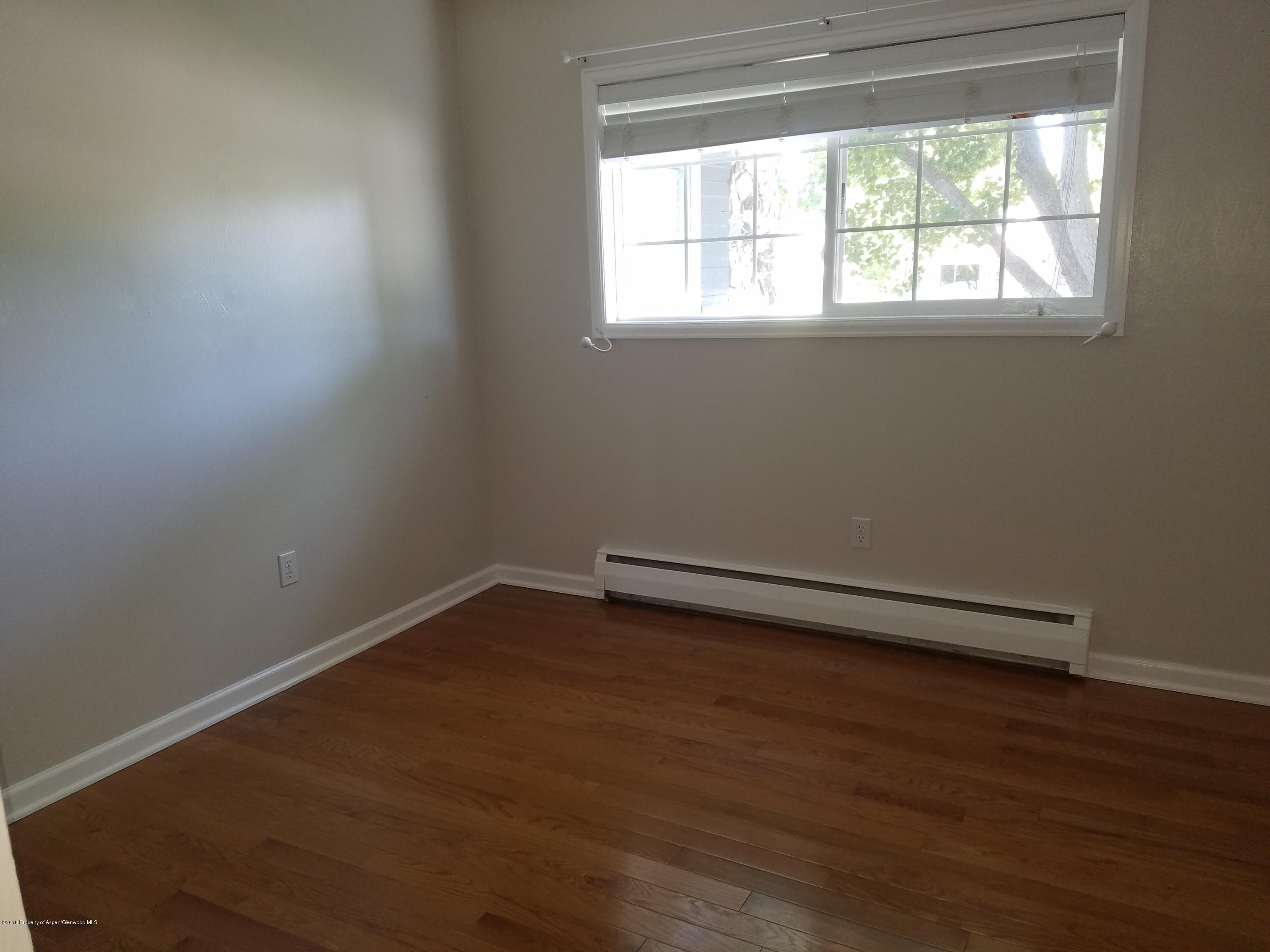 730 Green Street Craig, CO 81625 - Photo 16 of 34 an empty room with a window