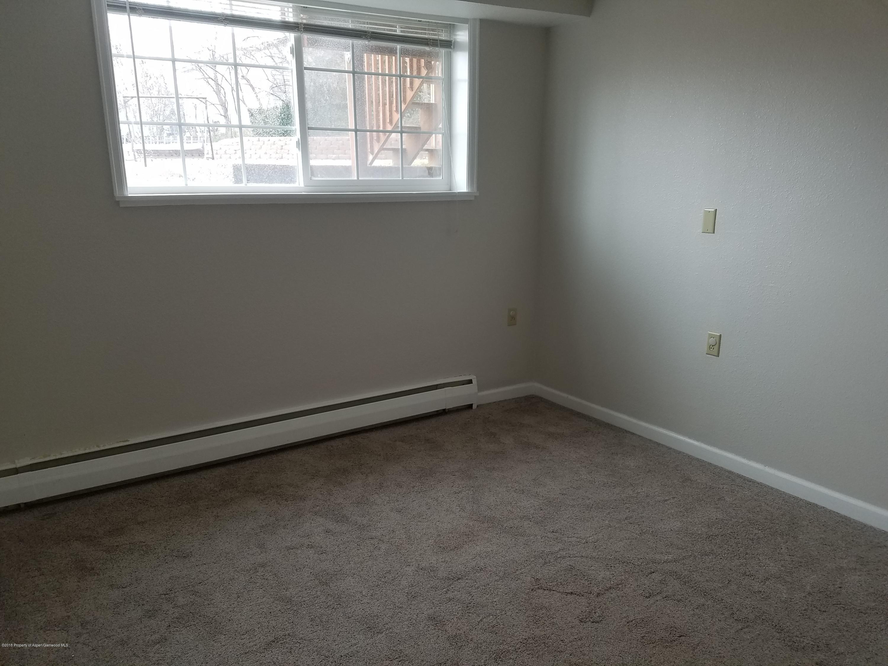730 Green Street Craig, CO 81625 - Photo 18 of 34 an empty room with a window