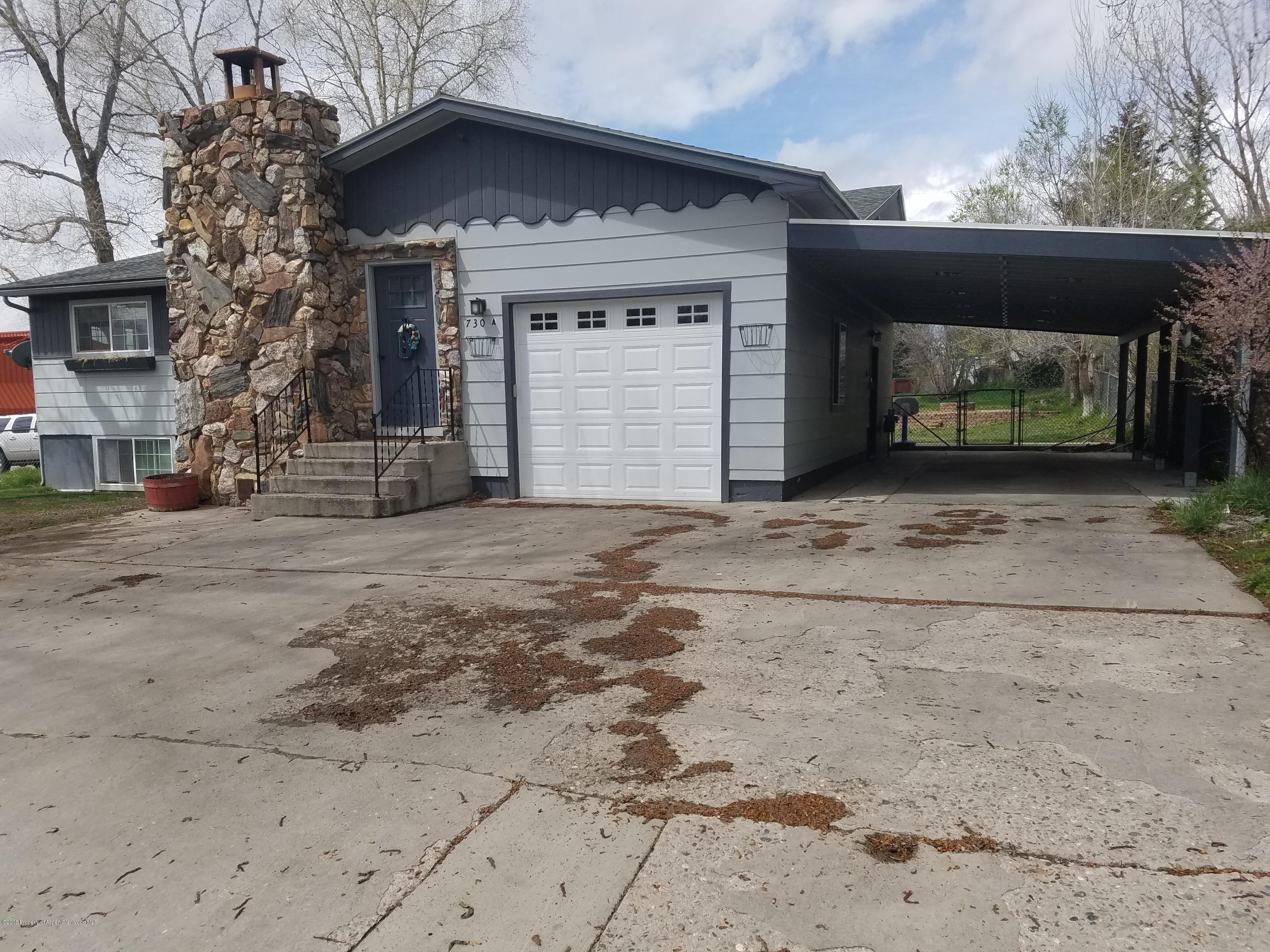 730 Green Street Craig, CO 81625 - Photo 2 of 34 a front view of a house with a yard