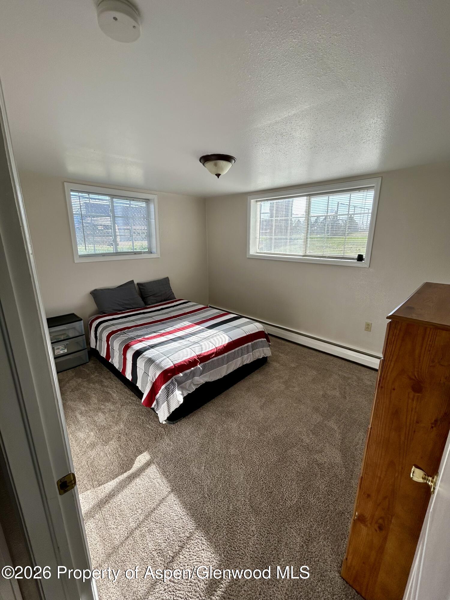 730 Green Street Craig, CO 81625 - Photo 25 of 34 a bedroom with a bed and a window