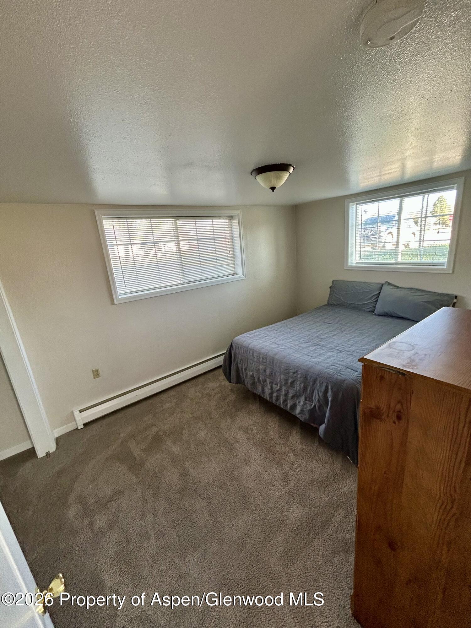 730 Green Street Craig, CO 81625 - Photo 27 of 34 a bedroom with bed and window