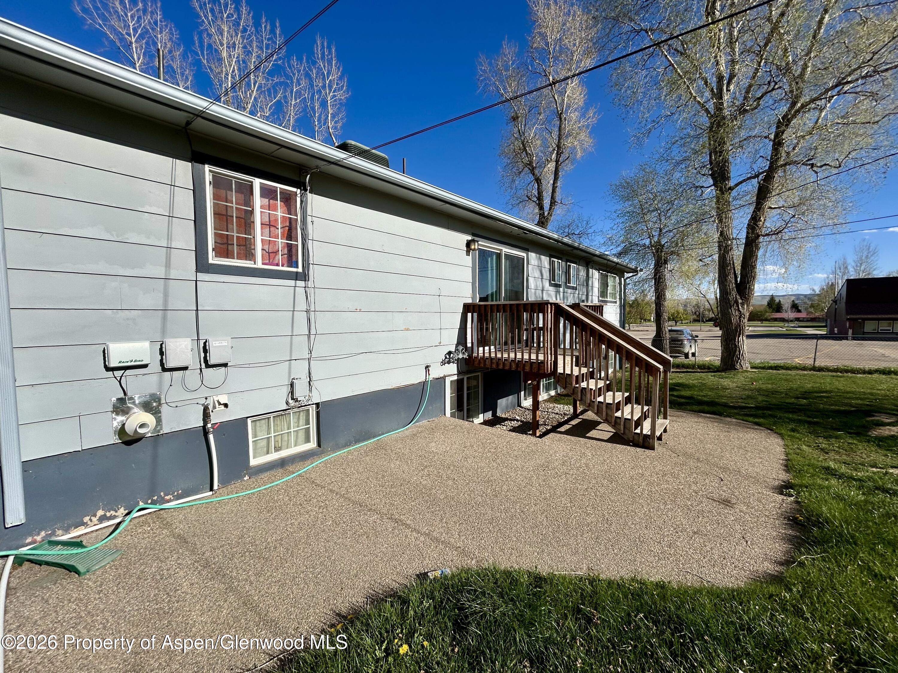 730 Green Street Craig, CO 81625 - Photo 31 of 34 a view of a house with a yard