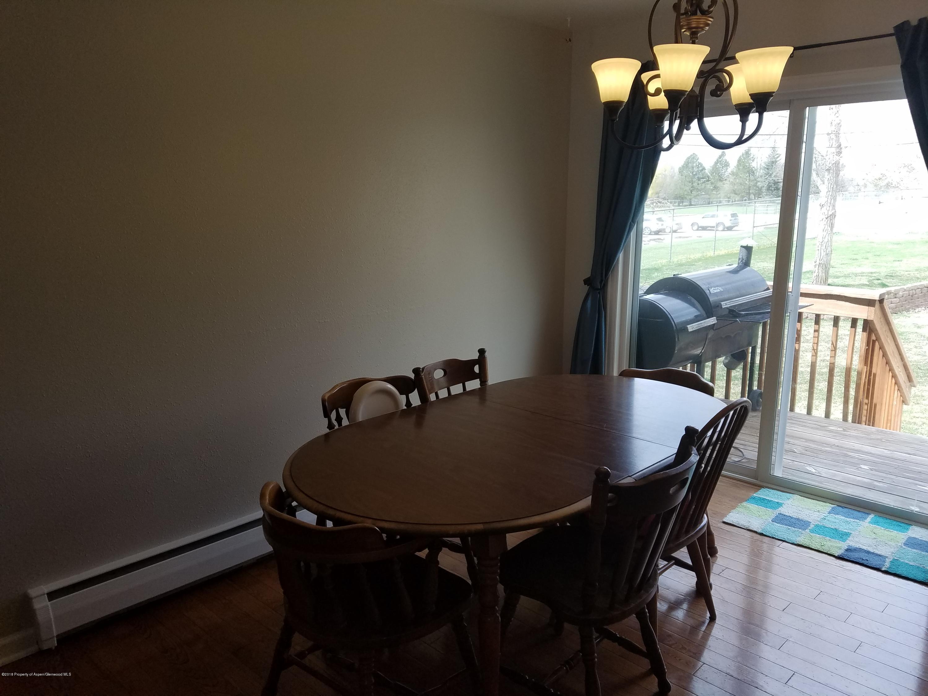 730 Green Street Craig, CO 81625 - Photo 8 of 34 a dining room with furniture and window