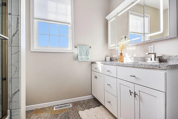 a bathroom with a sink and a mirror